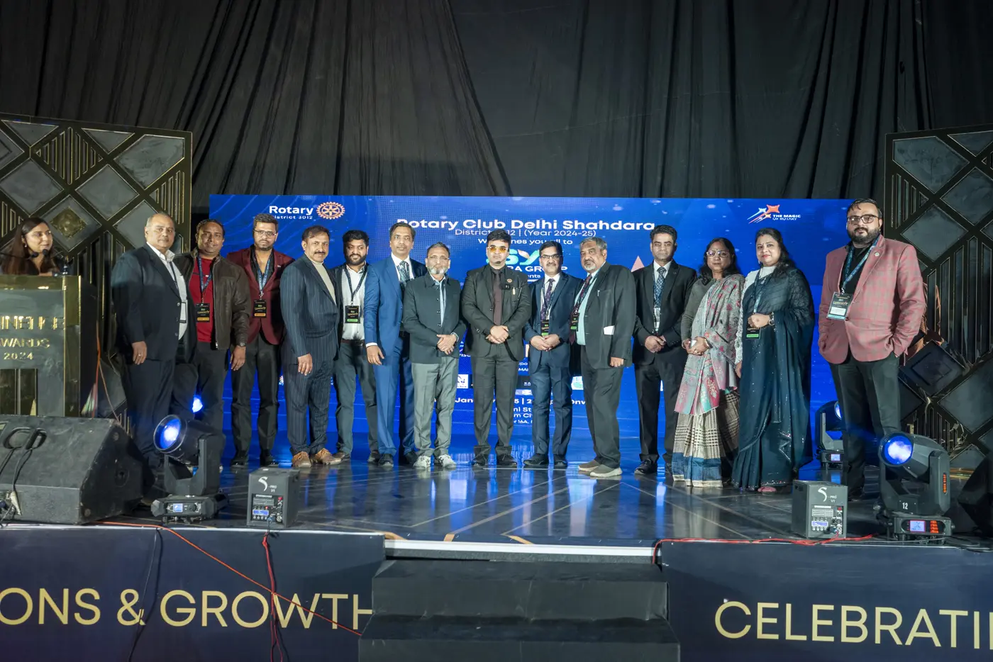 Group photo on stage at a Rotary Club Delhi Shahdara awards evening, from the GRO-MSME photo gallery
