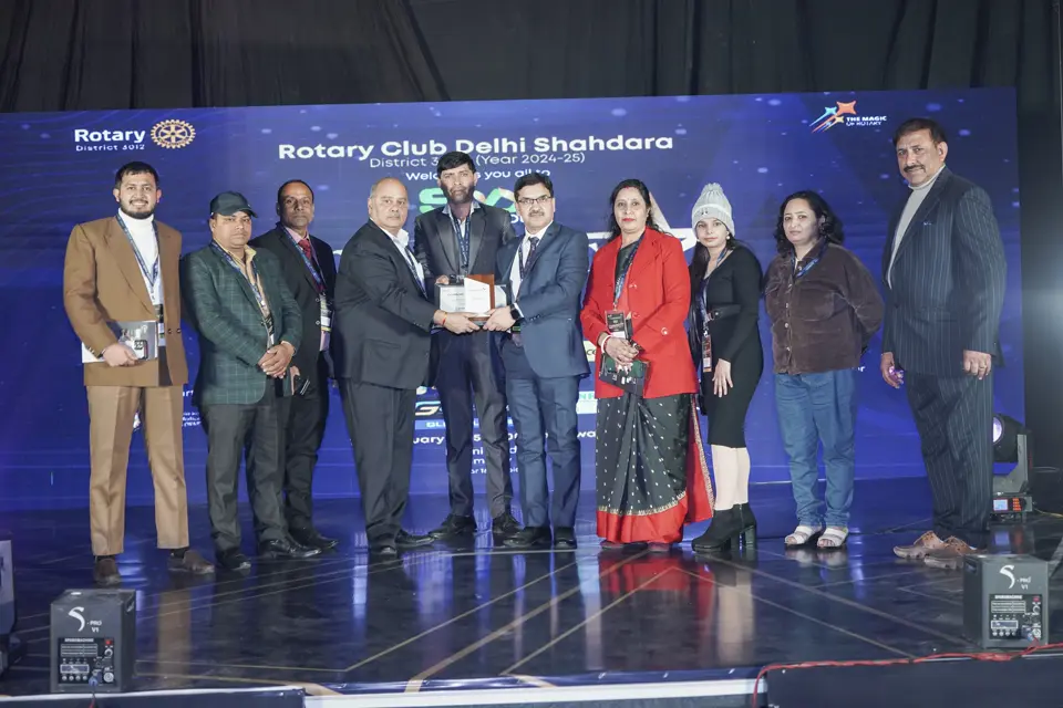 Award presentation on stage with guests at the Rotary Club Delhi Shahdara MSME awards