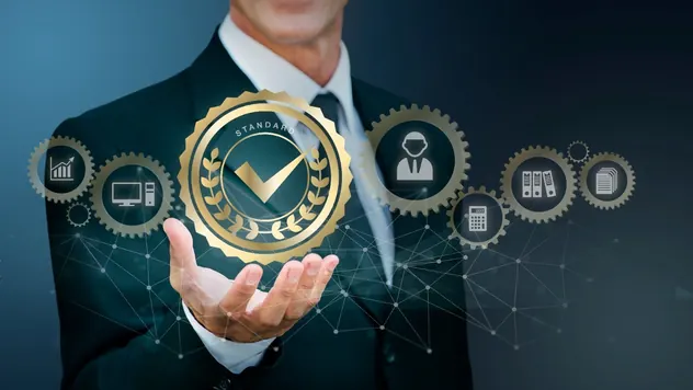 Businessman holding a glowing certification badge surrounded by business icons